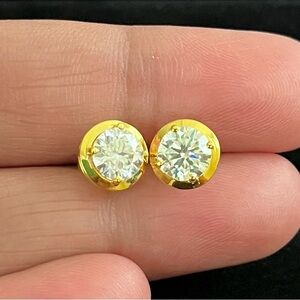 1 carat moissanite (2 carats total). Available in 14k white or yellow gold.